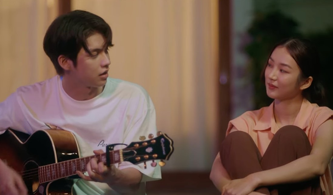 Good Old Days series still — a conversation over guitar