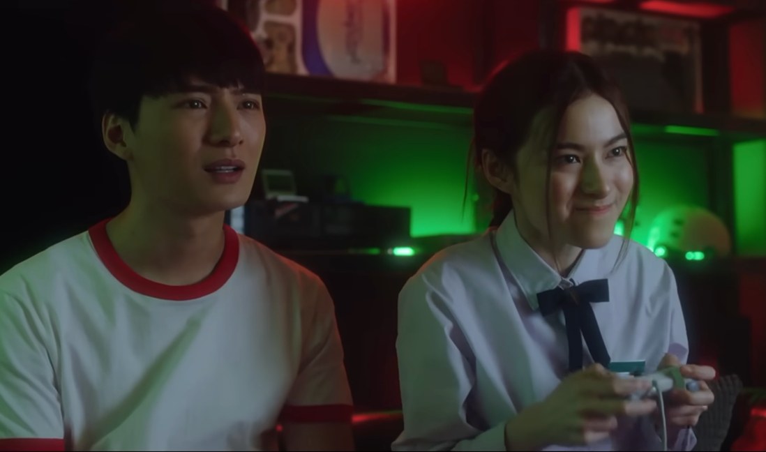 Good Old Days series still — a couple playing a video game