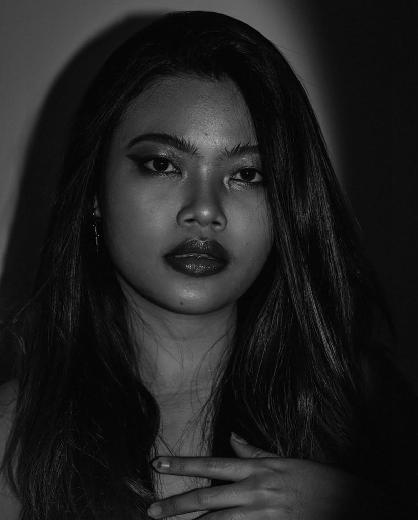 Dark portrait of a woman with long hair