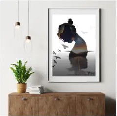 Framed poster mockup on a wall above a wooden cabinet