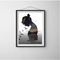 Framed poster mockup hanging on a white wall