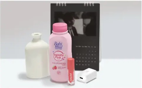 Still-life composition with vases, a pink bottle, a calendar and a power bank